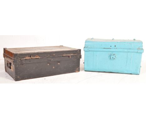 Two retro vintage 20th century metal trunks chests. One being in a light blue colourway with pull handles to each side, toget