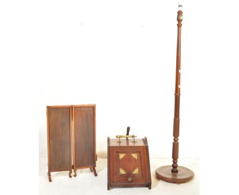A collection of vintage early 20th Century mahogany items. Comprising of a coal scuttle, standard lamp and a standing desk tr