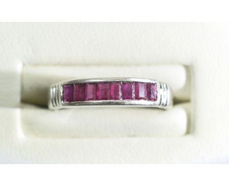 14ct White Gold Channel Set Ruby Ring. The Eight Rubies of Good Colour. Marked 14ct. Ring Size N - 0. 