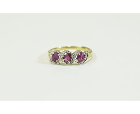 9ct Gold Diamond & Ruby Ring. 3 Oval cut rubies between diamond set spacers. Fully hallmarked, ring size M