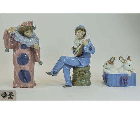 Nao by Lladro Figurines ( 3 ) In Total. 1/ Boy Clown Figure, 8 Inches Tall. 2/ Boy In a Harlequins Costume Playing a Lute (fi