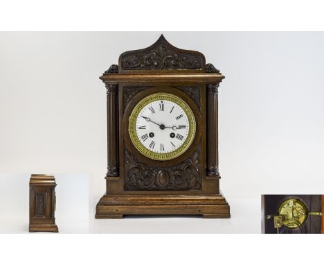 A Nice Quality Late 19th Century Carved Oak Cased 8 Day Pendulum Mantel Clock, Strikes Hour and Half Hour with Outer Wheel, W