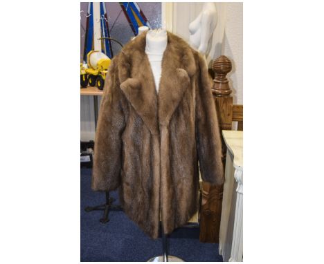 Light Brown Saga Mink Long Jacket. rever collar, slit pockets and fully lined. Label to interior reads 'Furs by Stephen. Very