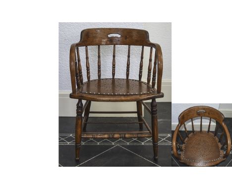 Early 20th Century Spindle Back Oak Captains Chair with Bobbin Turned Spindles Legs and Stretched Buttoned Seat. Stands 29.75