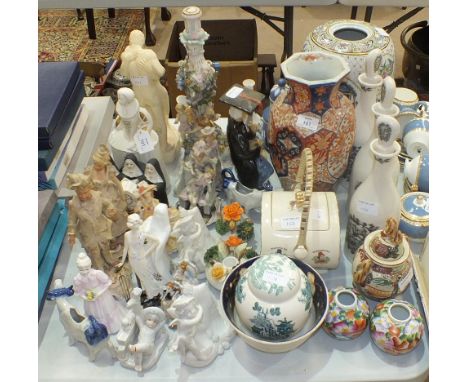 A Poole figurine 'Elizabeth I', 25cm high, a Coalport 'Flower Girl' figurine, other figures, a Masons, Twining & Co. tea cadd