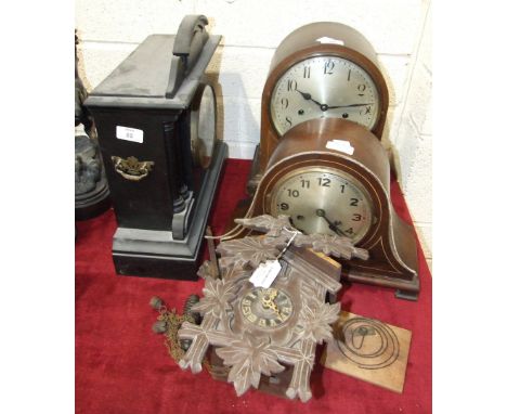 A Junghans, Wurtenburg, inlaid mahogany arch-top chiming mantel clock, 34cm high, an ebonised wood striking mantel clock, a w