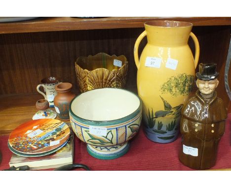 A Torquay Pottery two-handled vase decorated with a Kingfisher, 31cm high, three other pieces, a small terracotta vase decora