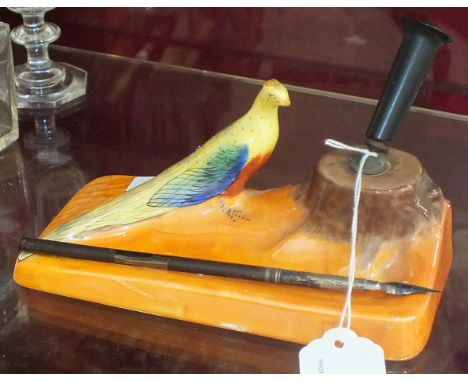 A Carlton Ware desk pen stand decorated with a brown tree stump and a pheasant, on a rectangular orange base, 18cm wide, 8cm 