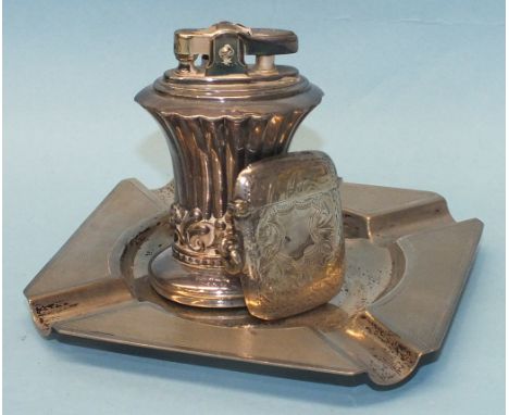 A silver Vesta case with engraved decoration, Birmingham 1914, an engine silver ashtray, Birmingham 1955 and a plated Ronson 