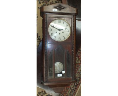 An oak-cased chiming wall clock, 83cm.