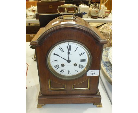 A mahogany cased striking arch-shaped bracket clock, the enamel dial marked 'E Sermon, Torquay', the movement stamped 'Japy F