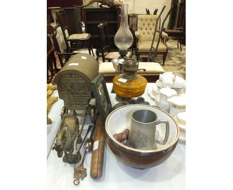 A brass coal helmet, 37cm high, three oil lamps, an oak punch bowl with plated mounts and ceramic liner and other metalware.