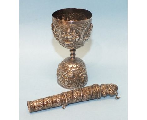 A Middle Eastern embossed white metal wager cup decorated with deities, 9cm high and a white metal button hole holder, 11cm, 