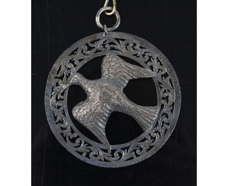A large Victorian silver Masonic? pendant of circular form, the central eagle within a scrolling openwork surround, marks rub