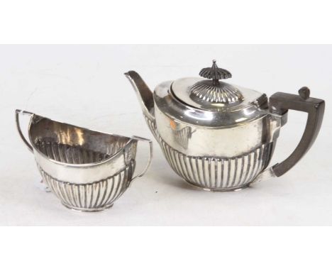 A George V silver bachelor's teapot of reeded oval shape together with a matching sugar bowl, London 1913, William Hutton &am