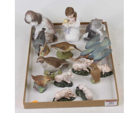 A Lladro porcelain figure of a puppy, modelled seated with a butterfly on its tail, height 11cm, together with another Lladro