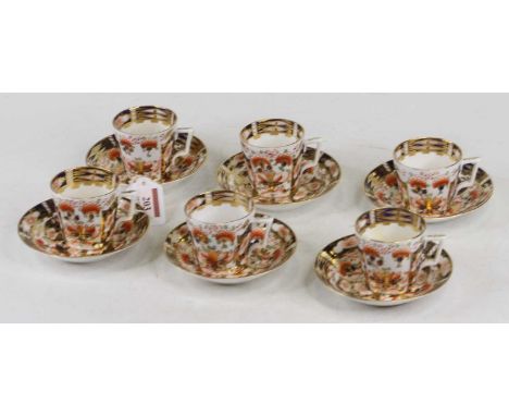 A set of 6 Derby porcelain coffee cans and saucers in the Imari palette, red mark to underside