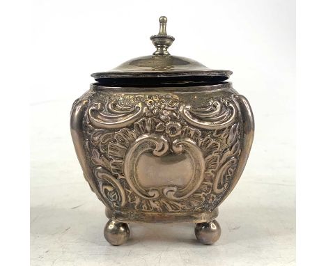 A Victorian silver tea caddy, of bombe shape, repousse decorated with scrolls and flowers, on bun feet, Chester 1899, Jones &