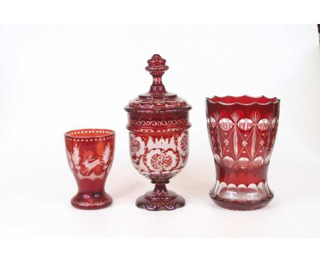 A 19th century ruby overlaid glass vase, h.18cm; together two other similar (3)