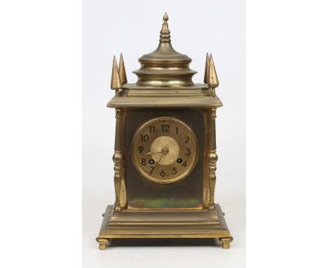 A 19th century brass eight-day mantel clock, the gilt dial showing Arabic numerals, striking on a bell, h.31cm 