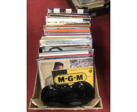 A collection of vintage LPs and singles to include Bobby Brown, Eddie Grant, and Whitney HoustonWebsite picture changed as th