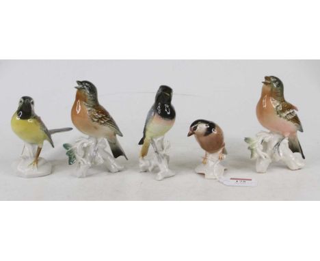 A Karl Ens porcelain figure of a wagtail, No. 7489, h.11cm; together with three other Karl Ens figures of birds; and a Goebel