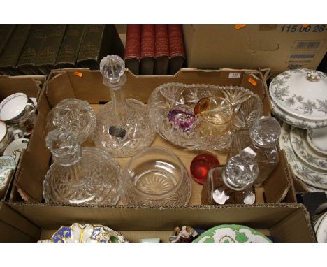 A collection of glassware to include crystal ship's decanter and paperweights