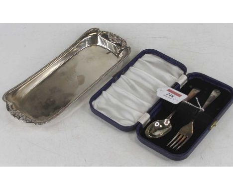 A George III silver wick scissor stand having a raised rim, later monogrammed, London 1813, 5.1oz, width 24cm, together with 