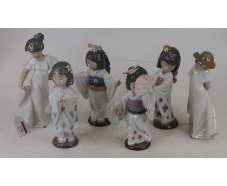 A Lladro porcelain figure of a Geisha girl, shown standing and holding two fans, h.19cm; together with three other Lladro por