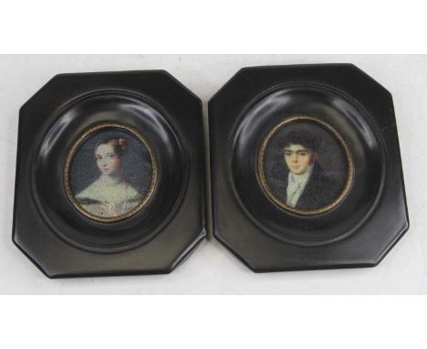 A pair of reproduction portrait miniature prints, each in an ebonised frame, 13.5x11.5cm