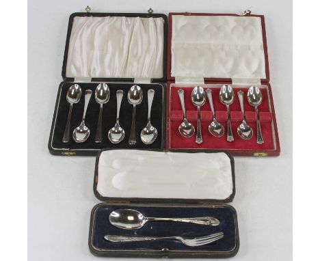 A cased silver two-piece christening set, comprising dessert fork and spoon, together with a cased set of six modern silver t