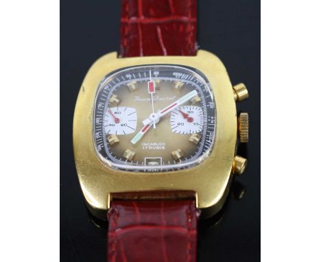 A 1970s Jean Decret gold plated and steel cased chronograph, manual wind movement, having a signed gilded dial with twin subs