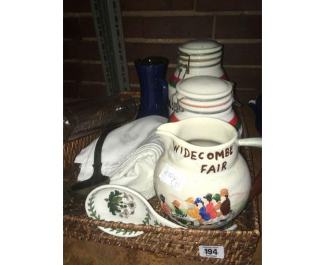 CANE TRAY WITH WIDECOMBE FAIR JUG, GLASS ROLLING PIN, SUGAR &amp; COFFEE JAR &amp; TABLE CLOTH