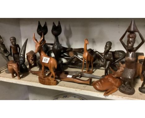 SHELF OF AFRICAN CARVED ANIMALS, FIGURES ETC