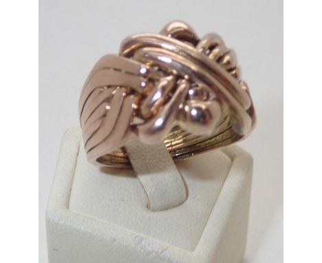 Gents presumed 18ct eight piece puzzle ring, size X, 13.8g Light wear otherwise goodP&P group 1 (£16 for the first item and £