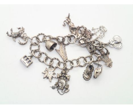 Vintage silver charm bracelet with 14 charms and padlock clasp, 45gP&P group 1 (£16 for the first item and £1.50 for subseque