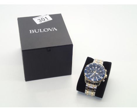 A boxed gents blue Bulova wristwatch on a bi-metallic bracelet with extra links. Working at lotting.P&P group 1 (£16 for the 
