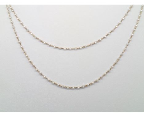 Vintage yellow metal and seed pearl two-strand necklace L: 85 cmP&P group 1 (£16 for the first item and £1.50 for subsequent 