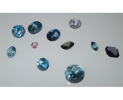 Loose gemstones: topaz of mixed colours, largest stone weighing 6.25cts, D: 10mmPlease note gemstones listed have been tested