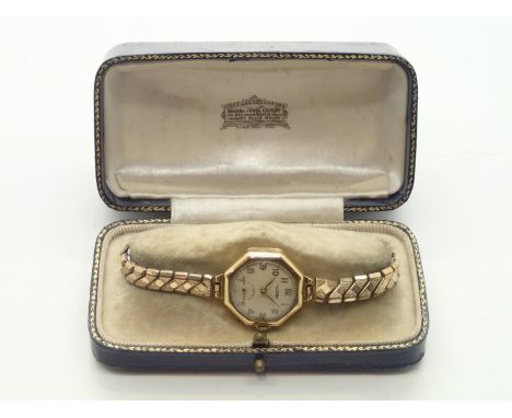 Vintage ladies Rotary 18ct gold cased wristwatch, the octagonal case containing a circular face with Arabic chapters and subs