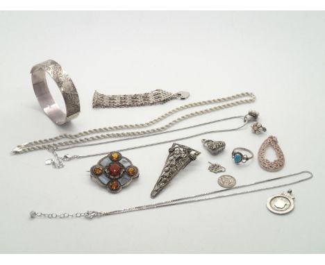 Hallmarked silver, sterling and white metal presumed silver jewellery to include a hinged bangle, gate bracelet, Scottish bro