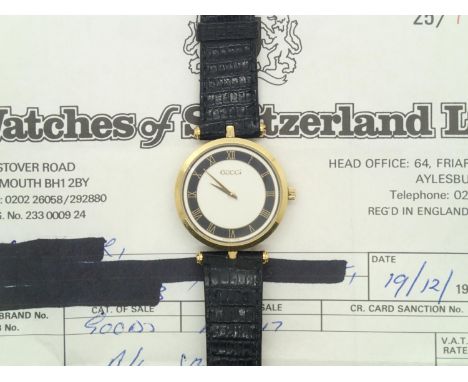 Vintage Gucci gents mid-size gold plated quartz wristwatch on a crocodile effect leather strap, the circular dial having Roma