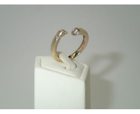 Unusual contemporary 14ct gold and diamond torq style ring. 4.3g, size NP&P group 1 (£16 for the first item and £1.50 for sub