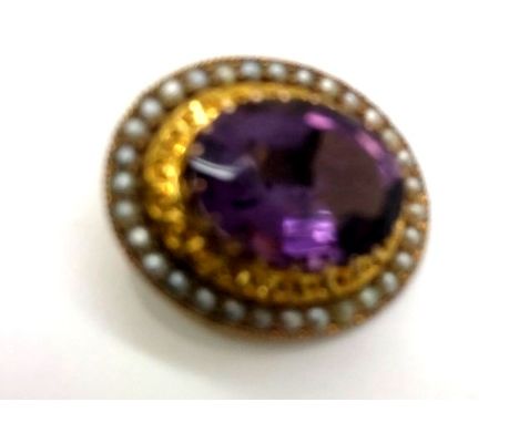 Large oval amethyst set in a presumed 9ct gold mount with screw back and surrounded by seed pearls, 5.2gP&P group 1 (£16 for 