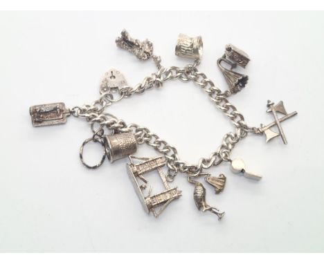 Vintage silver charm bracelet with 10 charms, 52gP&P group 1 (£16 for the first item and £1.50 for subsequent items) 