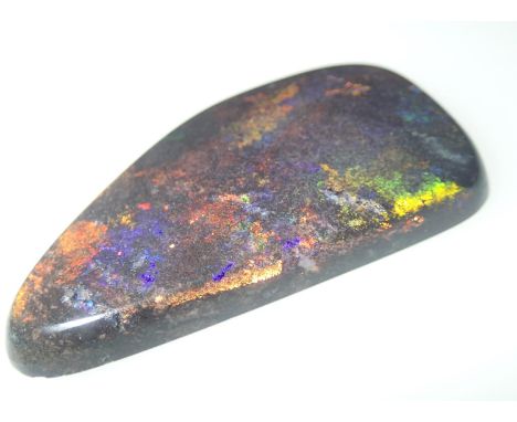 Loose gemstones: A large polished black opal weighing 62cts, 50mm x 26mmPlease note gemstones listed have been tested with Pr