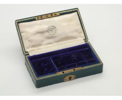 An Edwardian leather bound and velvet fitted gentleman's travelling jewellery case, spaces for cufflinks, studs, tie pins and