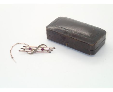 A boxed Edwardian 9ct gold amethyst and seed pearl brooch, L: 52 mm, 2.6gP&P group 1 (£16 for the first item and £1.50 for su