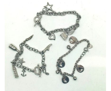 Three silver charm bracelets, total weight 50.0gP&P group 1 (£16 for the first item and £1.50 for subsequent items) 