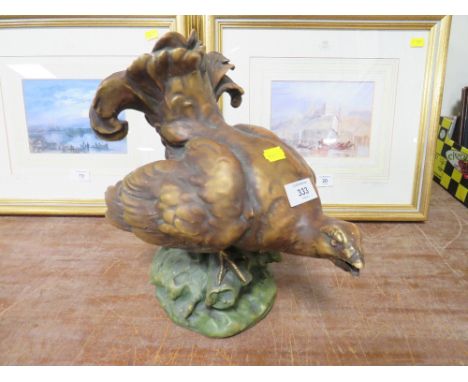AN ANTIQUE CERAMIC FIGURE OF A GROUSE S/D